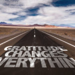 Gratitude Changes Everything written on desert road