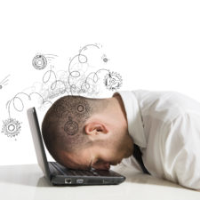 Concept of stress with businessman sleeping on a laptop